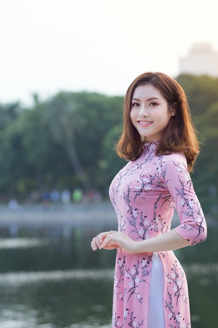woman standing in front of body of water